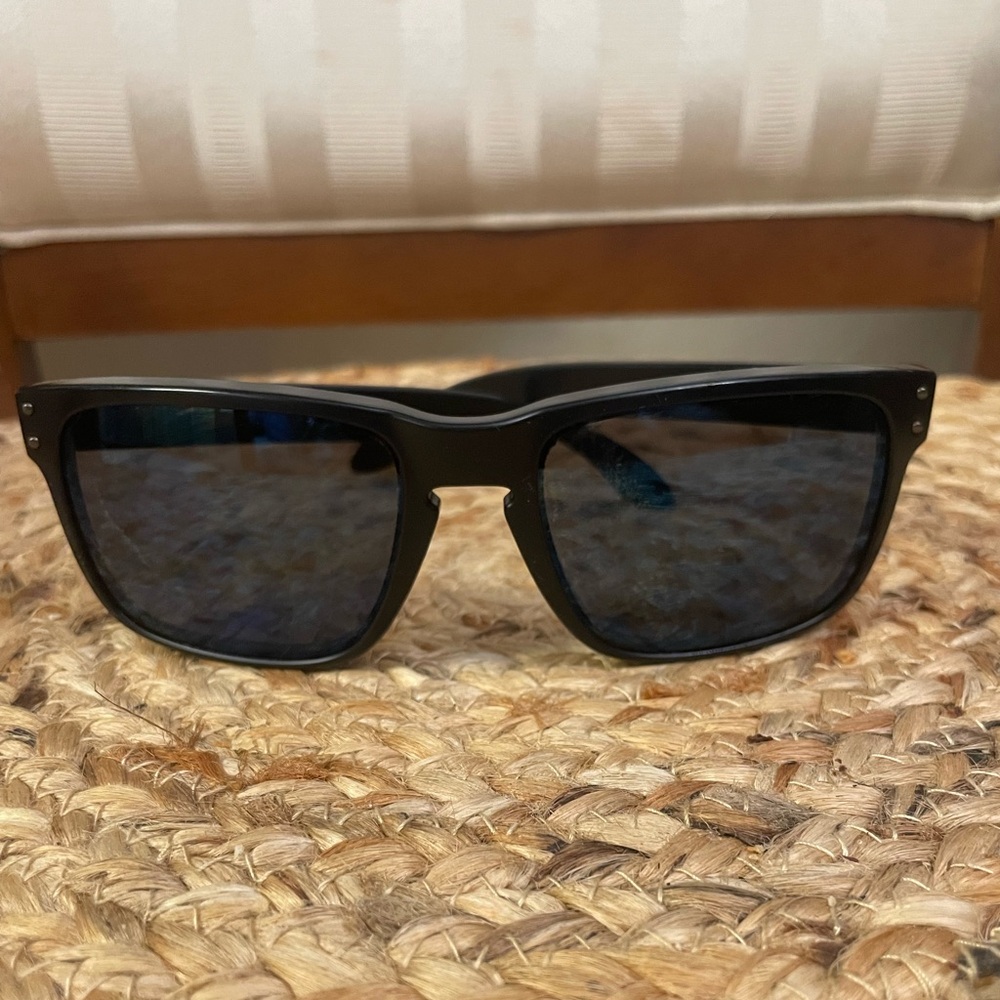 Black Oakley Sunglasses with Blue Lenses